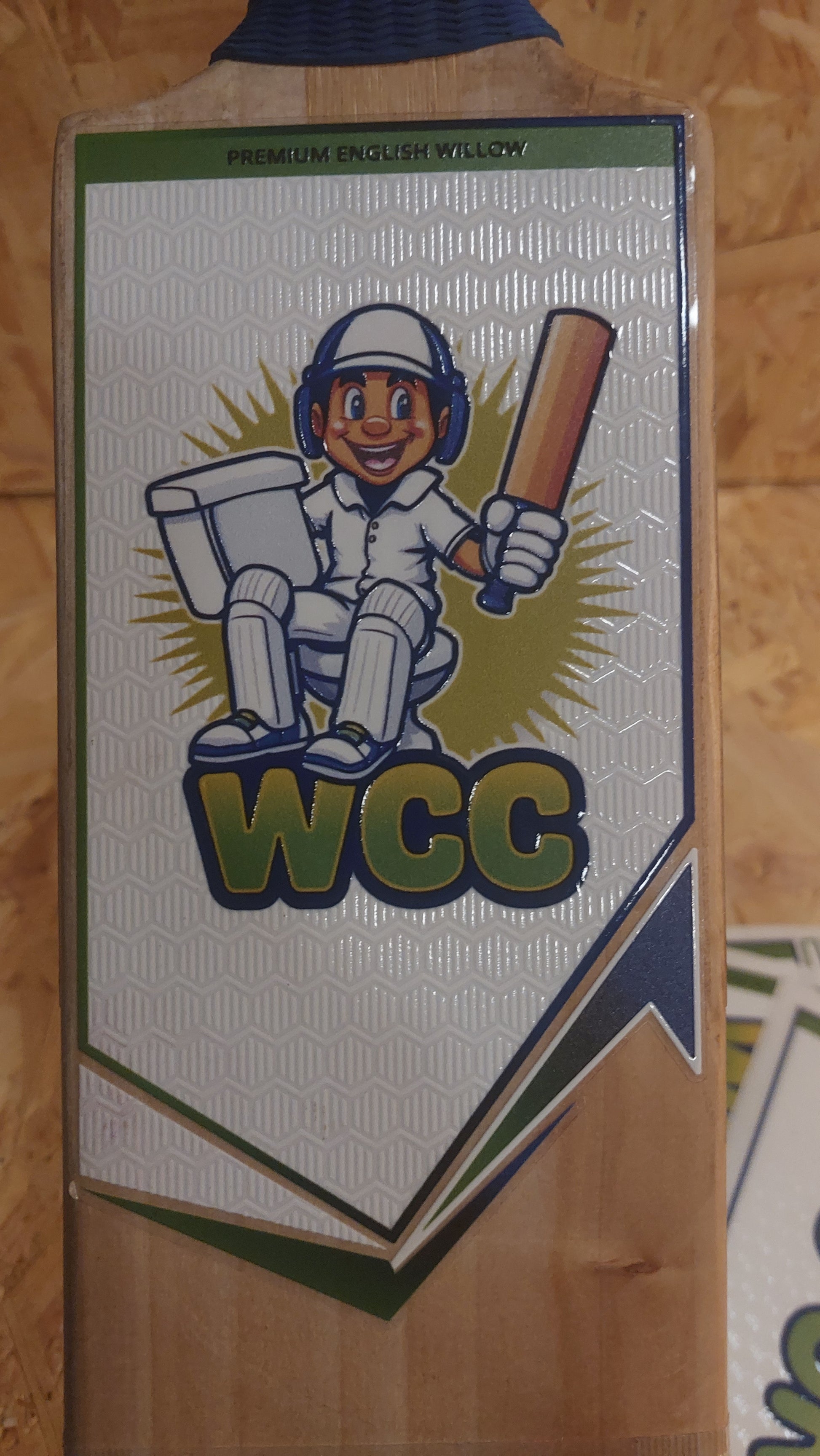 Front cricket bat sticker on a WC Cricket branded cricket bat