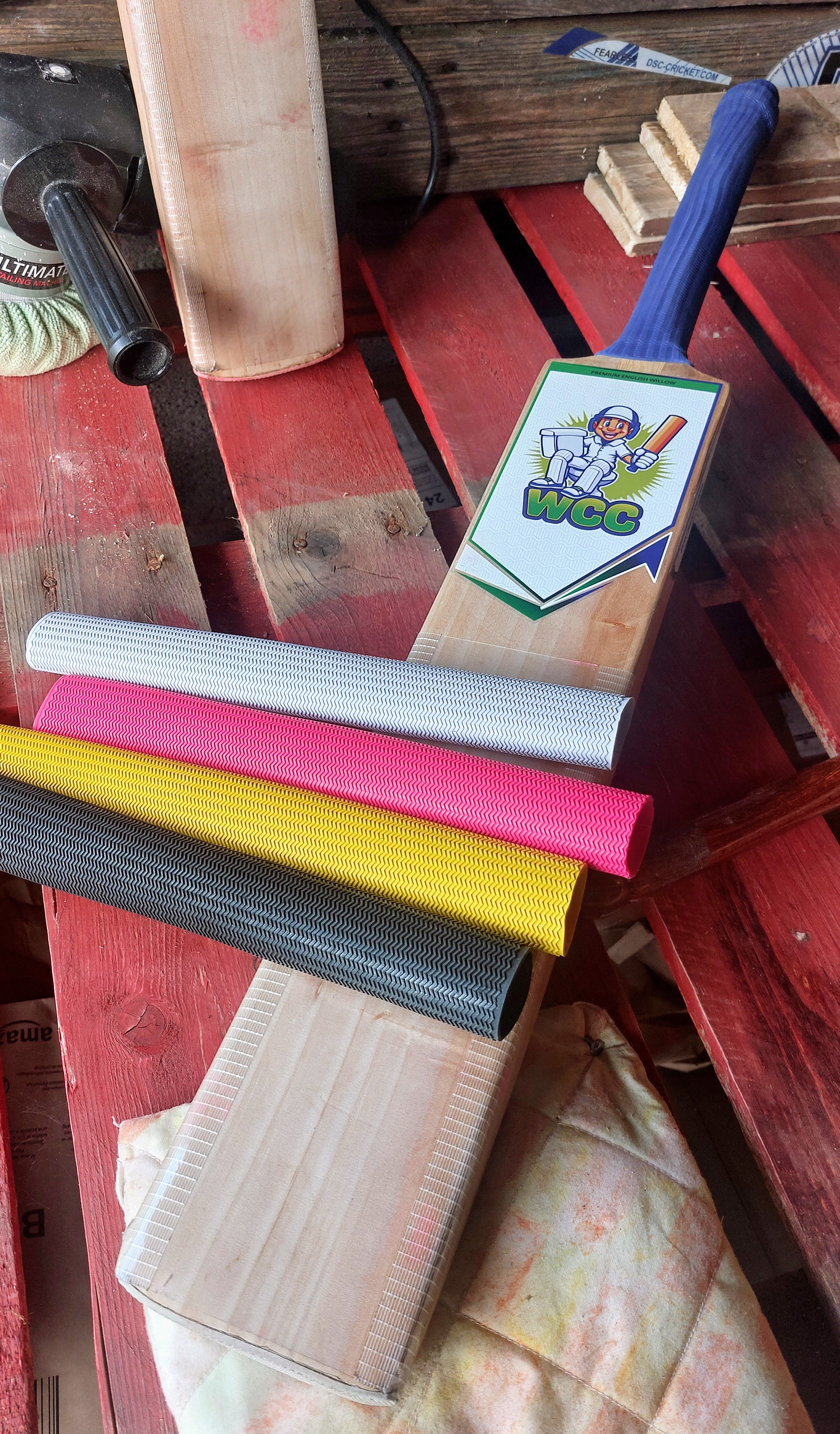 WC Cricket branded cricket bat with grips