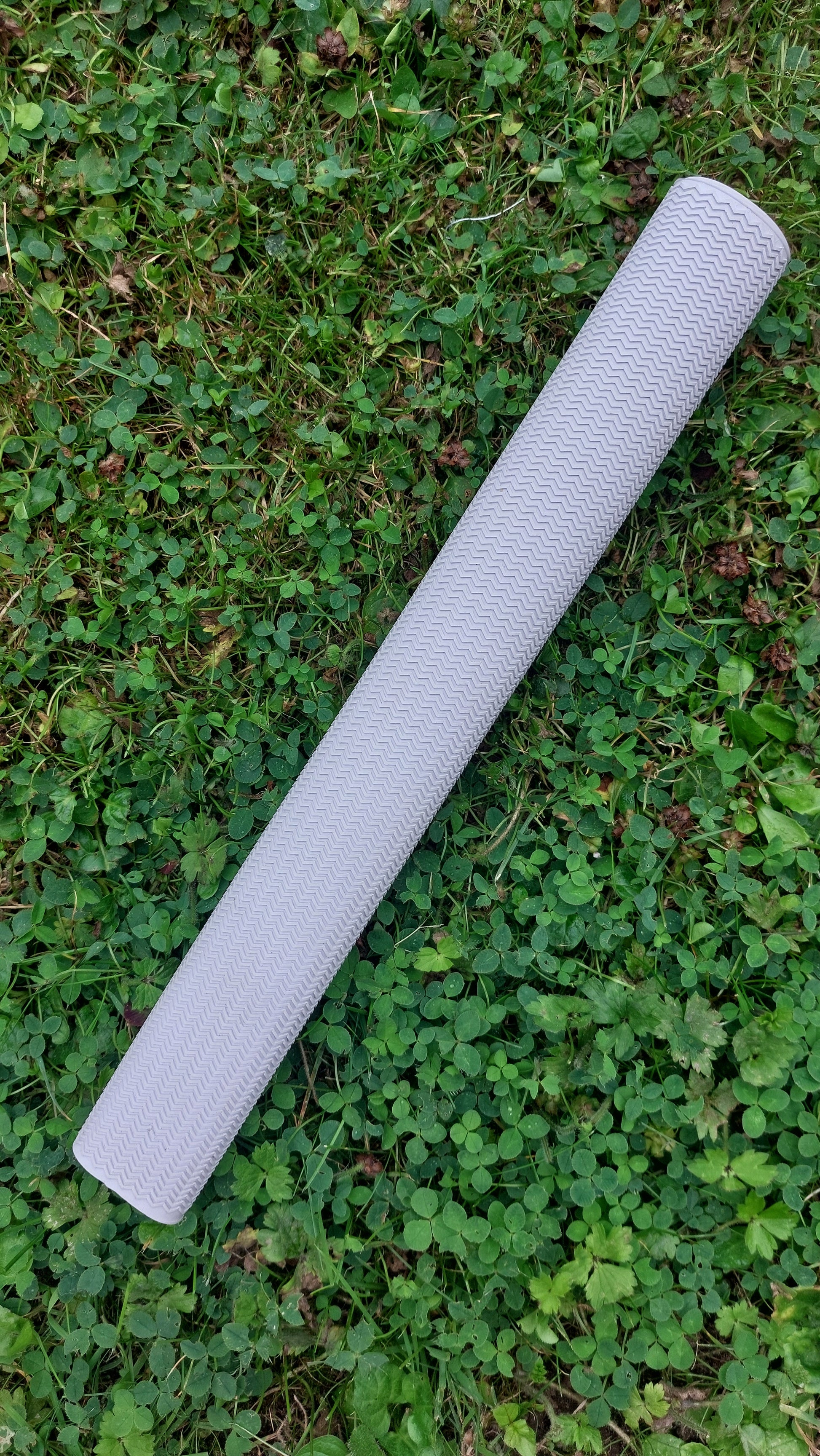 WC Cricket chevron cricket bat grip white rolled on grass for cricket bat restoration use