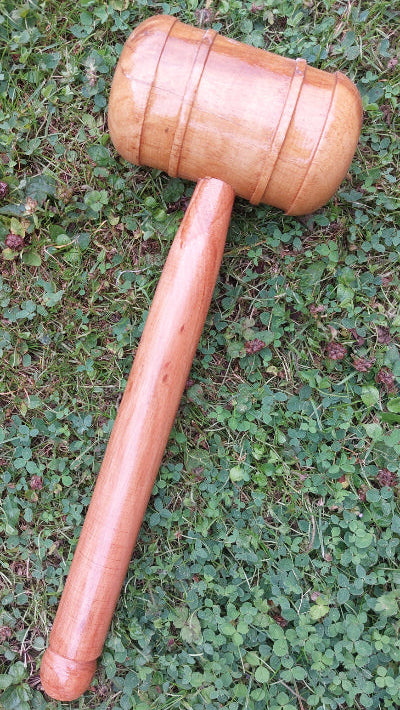 WC Cricket wooden cricket bat mallet for knocking in resting on grass for bat restoration