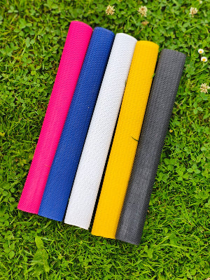 WC Cricket assorted coloured replacement chevron cricket bat grip rolls displayed on grass for restoration