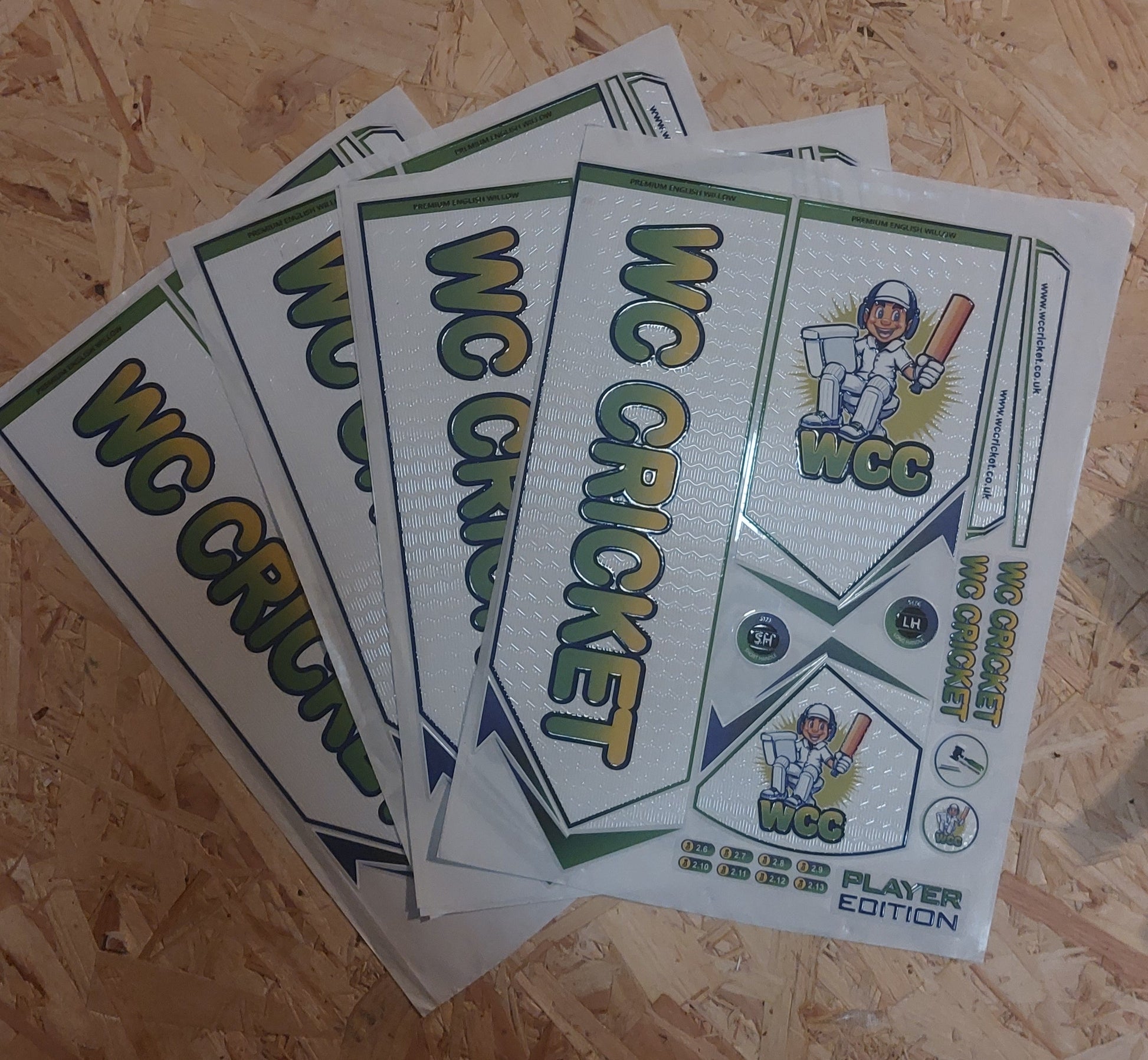 Multiple sets of WC Cricket branded cricket bat stickers