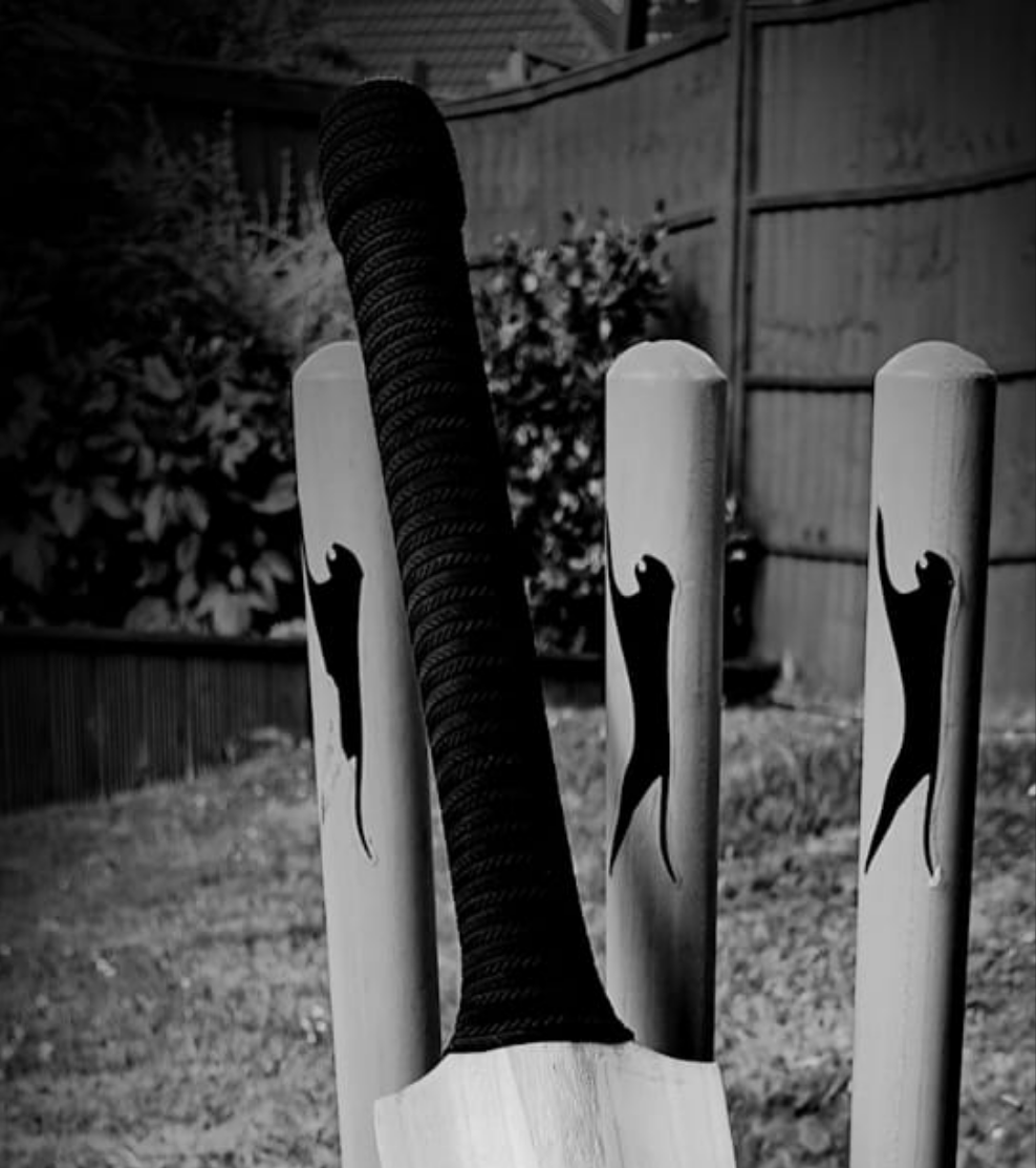 WC Cricket bat restoration showing black cricket bat grip and stumps for cricket bat grip replacement service