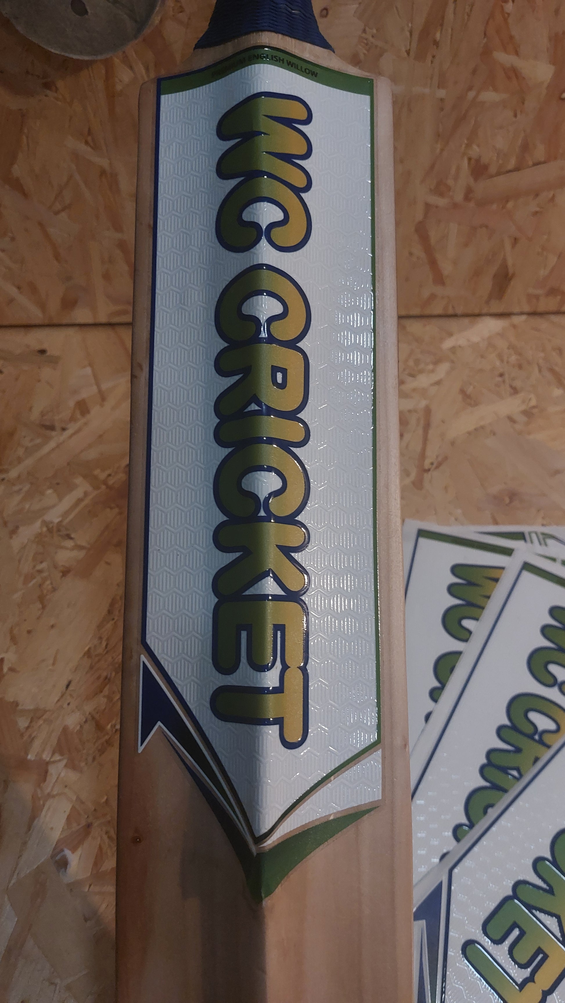 Back sticker displayed on WC Cricket branded cricket bat
