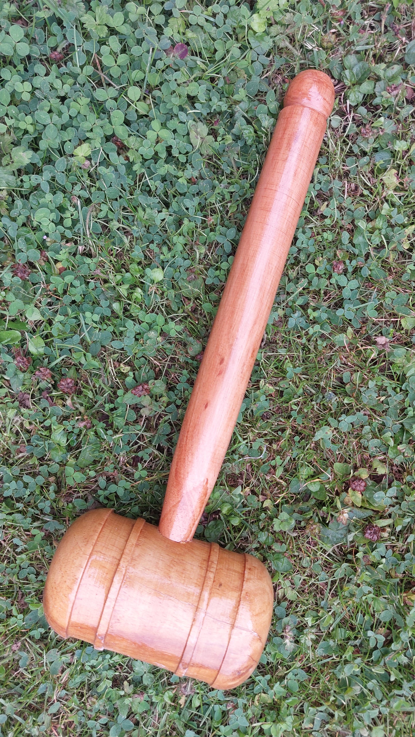 WC Cricket wooden cricket bat mallet for knocking in resting on grass for bat restoration