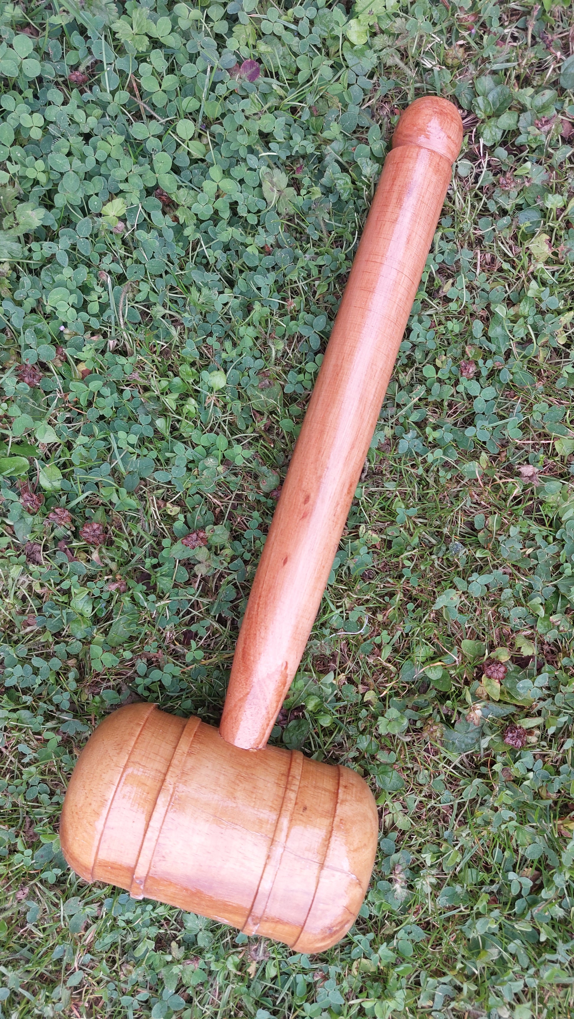 WC Cricket wooden cricket bat mallet for knocking in resting on grass for bat restoration